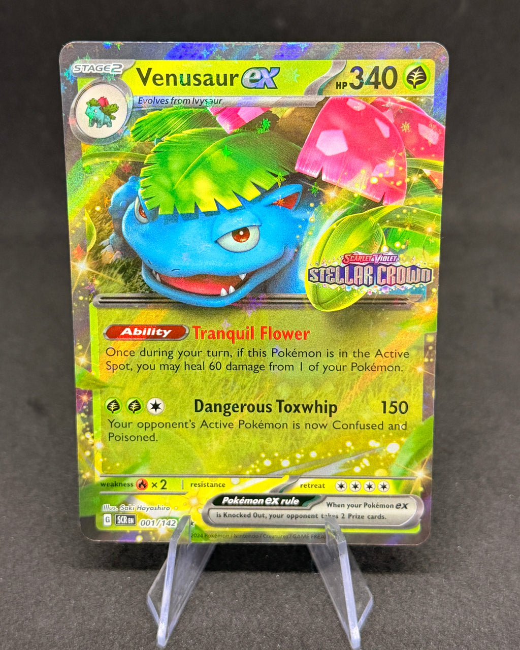 Pokémon trading card featuring Venusaur on a dark surface