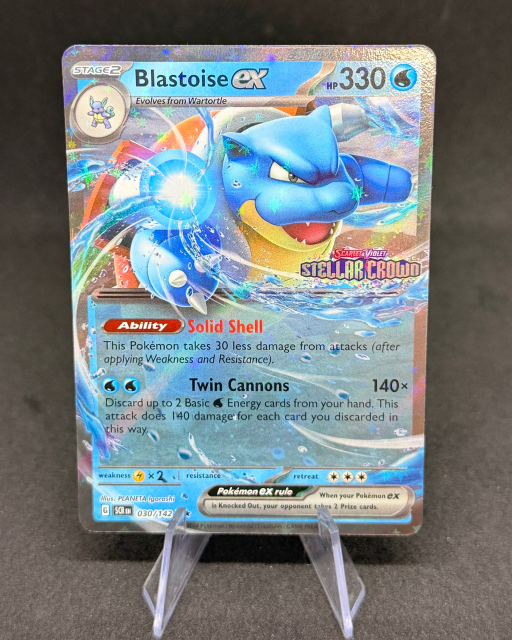 Pokémon trading card featuring Blastoise EX on a dark gray background