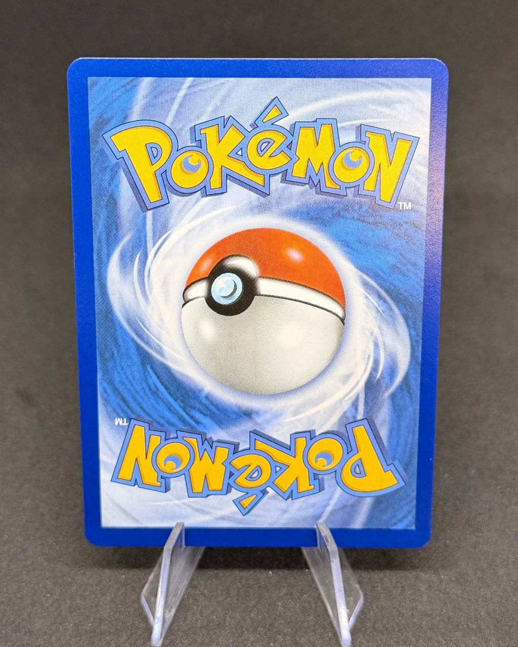 Pokémon trading card with a blue border on a gray background
