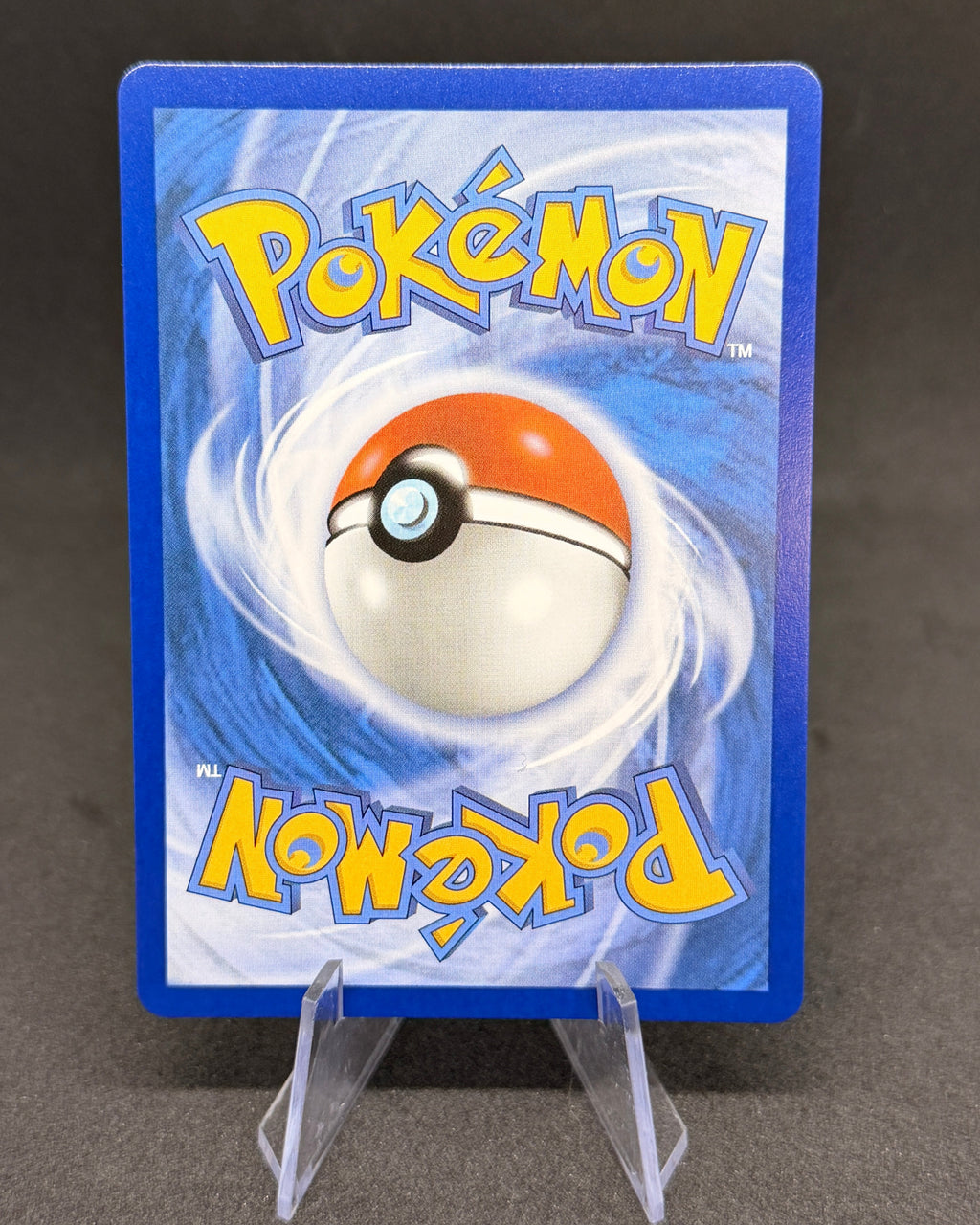 Pokémon trading card with blue border and Pokéball logo on a dark background